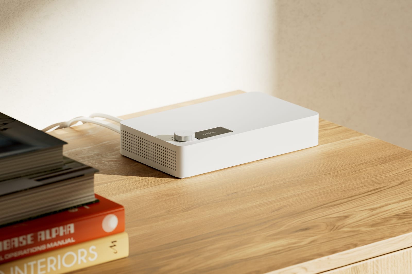 The Simple Things hub on a wooden sideboard beside a stack of books