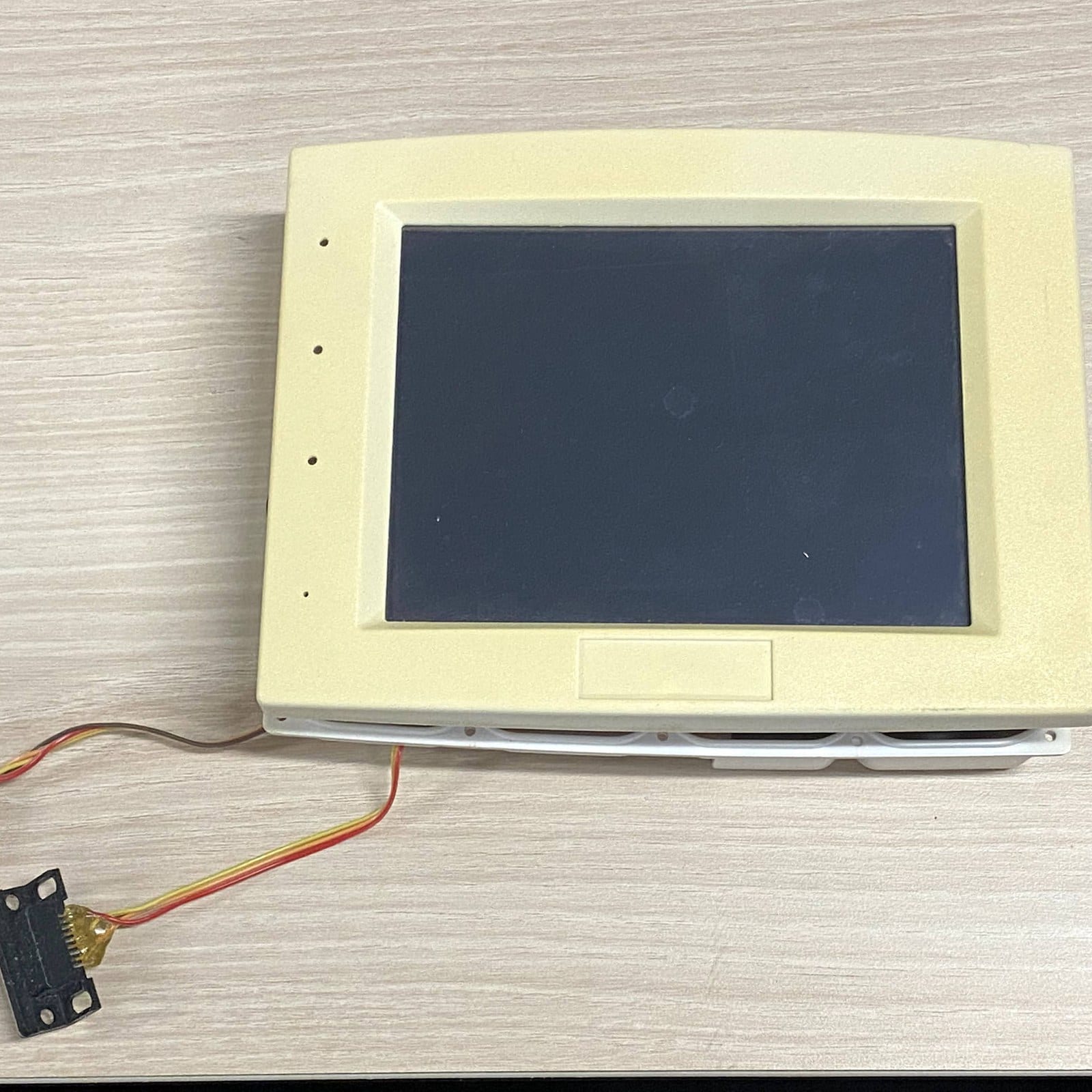 An early uControl touchscreen prototype in a beige housing, 2006